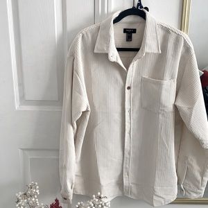 White/cream sweater or button up.